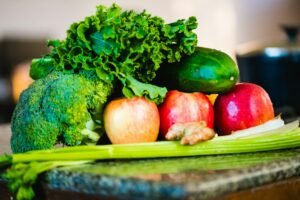 A display of frsh vegetables depicting the need to eat 5 portions of fruit and vegetables a day to maintain a healthy and balanced diet